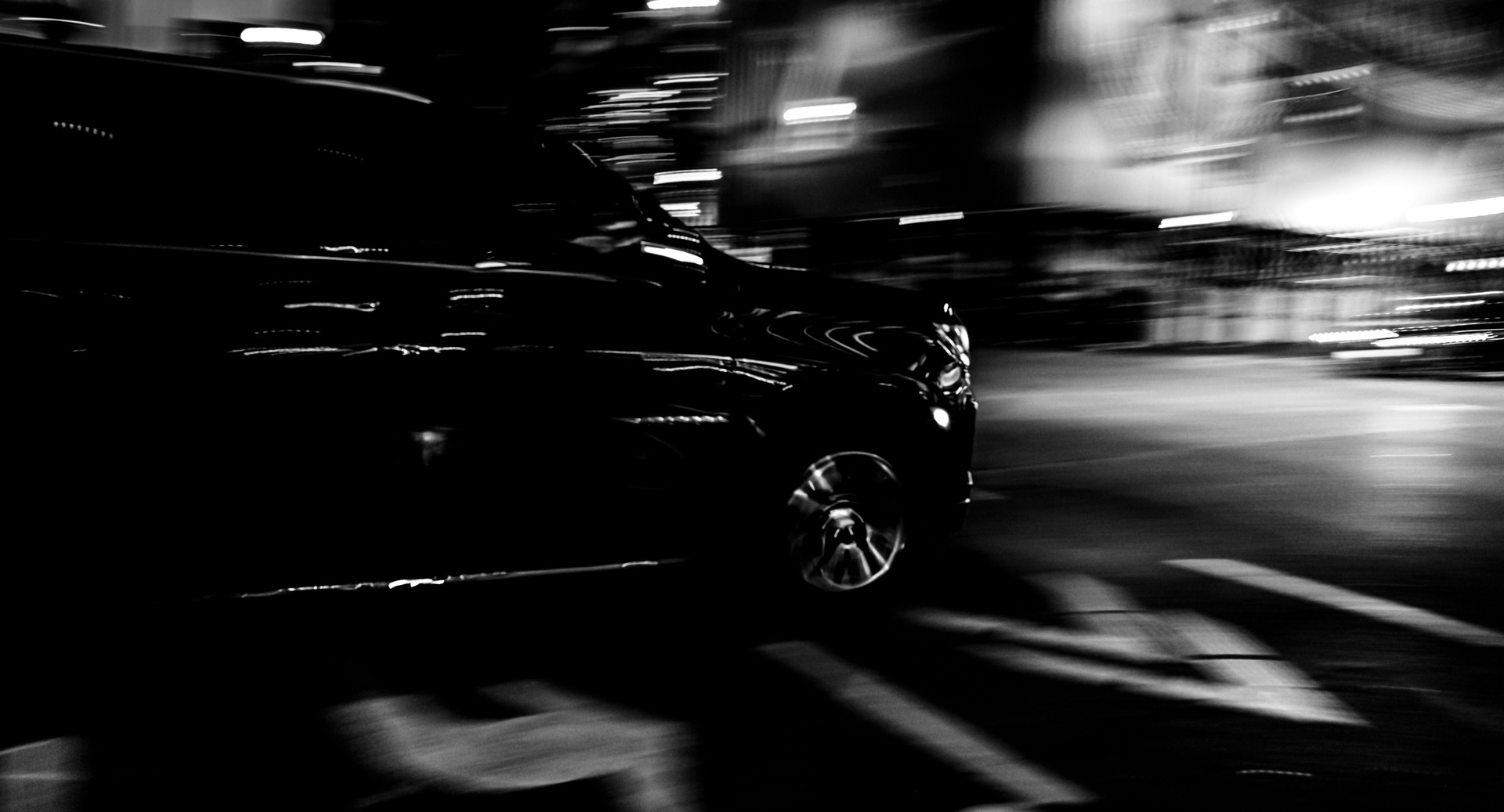 BLACK CAR IN BLURRED MOTION: NIGHT RUSH HOUR IN TORONTO, CANADA